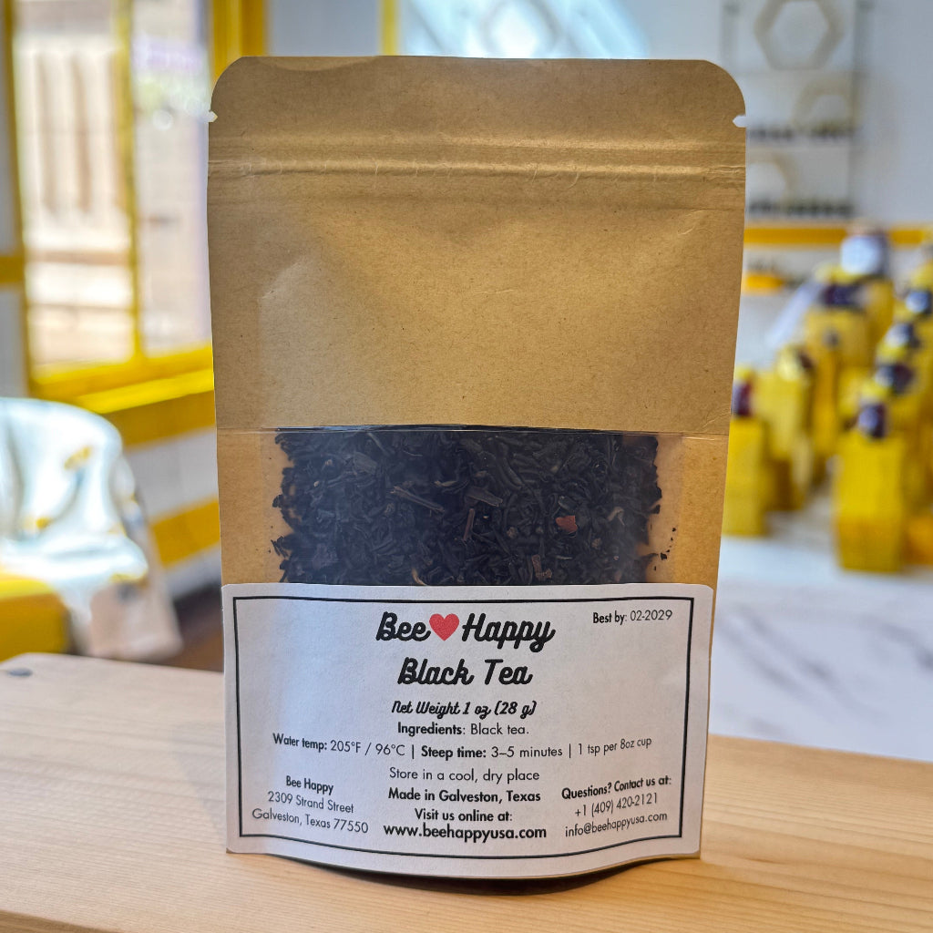 1 oz bag of black tea on a wooden surface