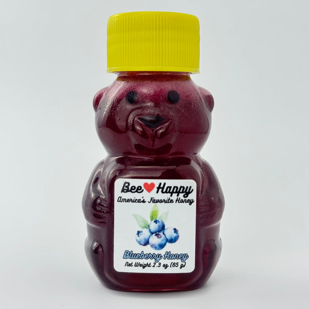 2.3 oz bear bottle of Blueberry Honey against a white background