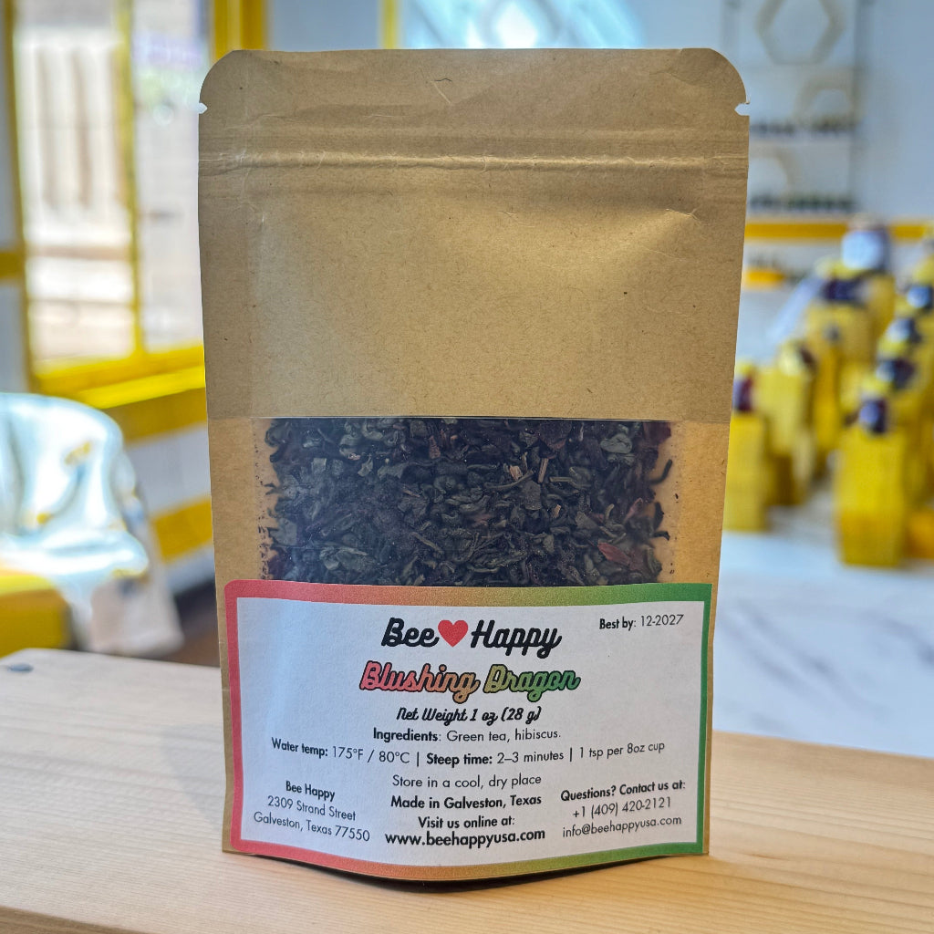 1 oz bag of Blushing Dragon tea on a wooden surface
