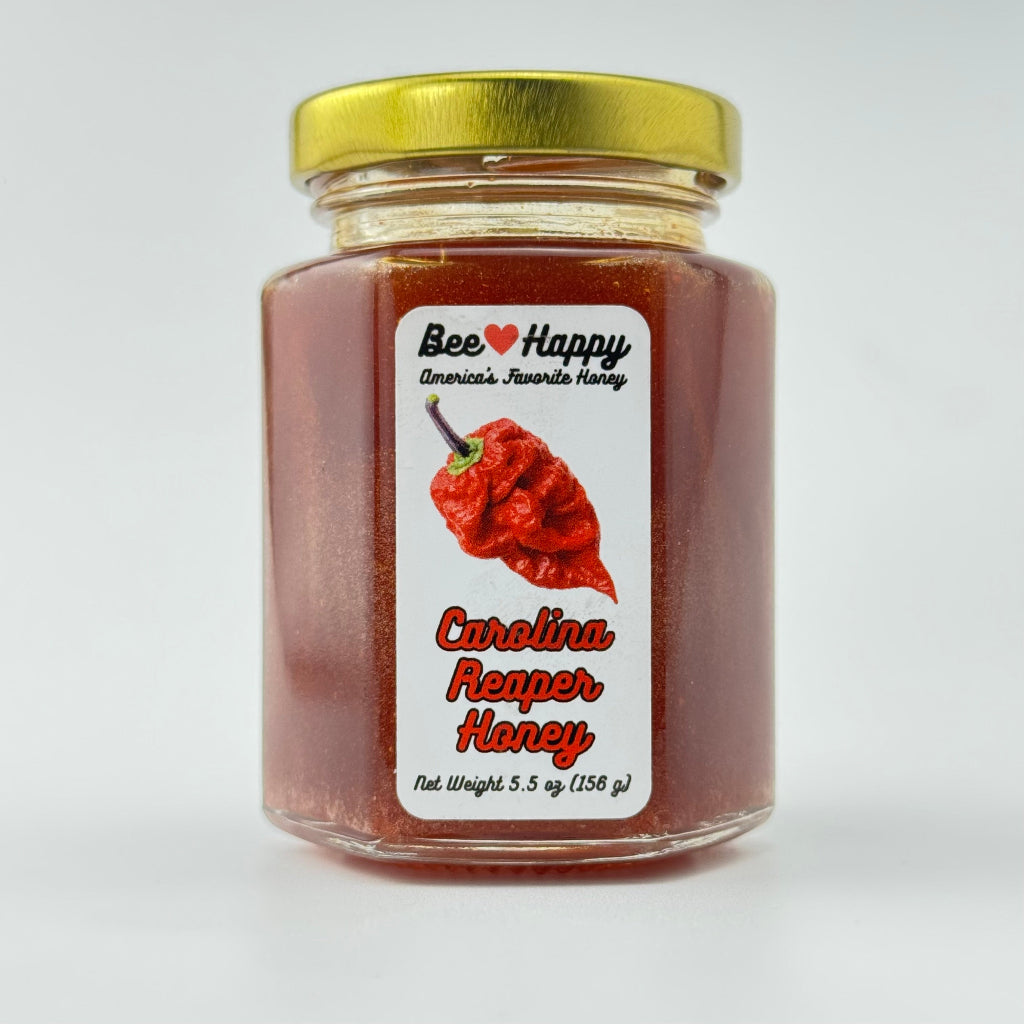 5.5 oz jar of Carolina Reaper Honey on a white background