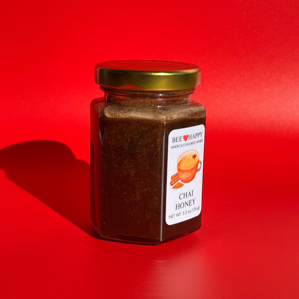 5.5 oz jar of Chai Honey on a red background