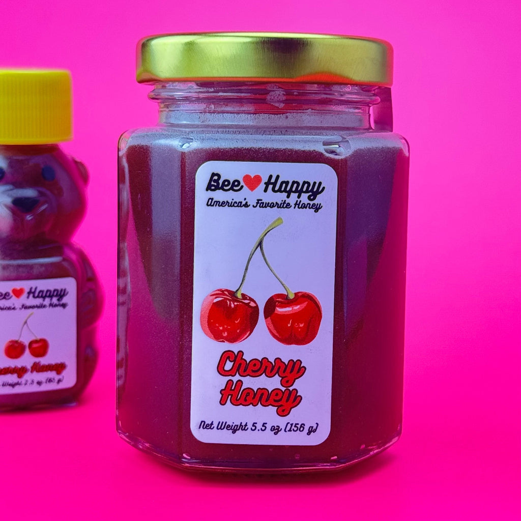 a 5.5 oz jar of Cherry Honey against a pink background