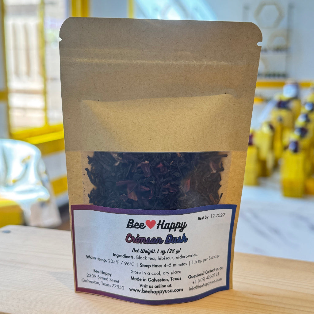 1 oz bag of Crimson Dusk tea on a wooden surface