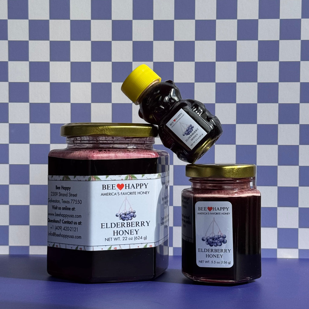 22 oz jar, 5.5 oz jar and 2.3 oz honey bear bottle of Elderberry Honey against a blue and white checkered background