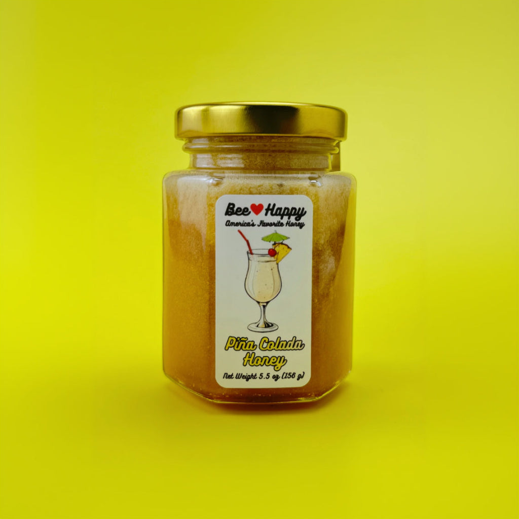 a 5.5 oz jar of Pina Colada Honey against a yellow background