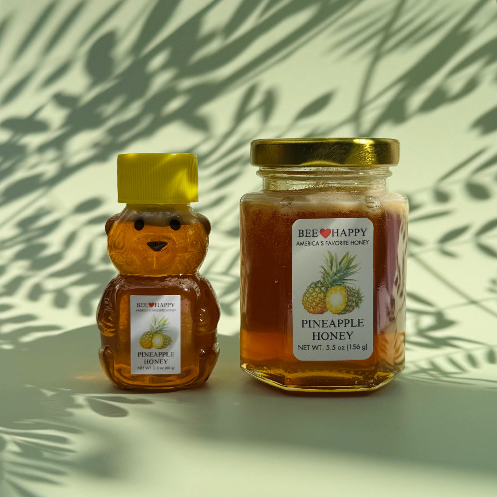 2.3 oz bear bottle and 5.5 oz jar of Pineapple Honey against a light background