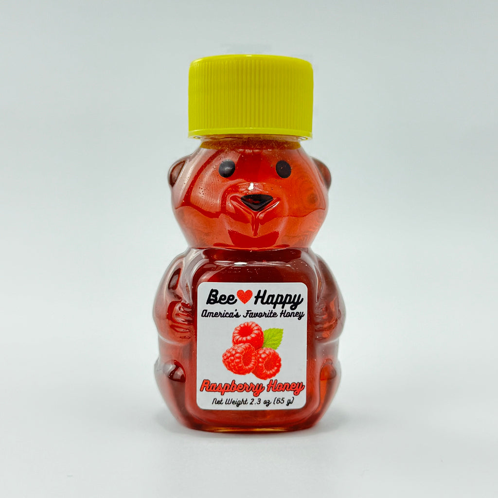2.3 oz bear bottle of Raspberry Honey against a white background