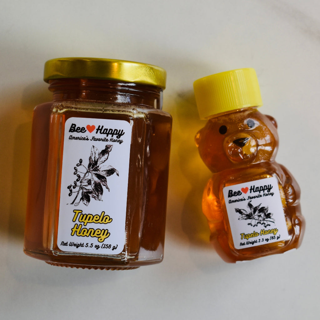 5.5 oz jar and 2.3 oz bear bottle of Tupelo Honey against a white background