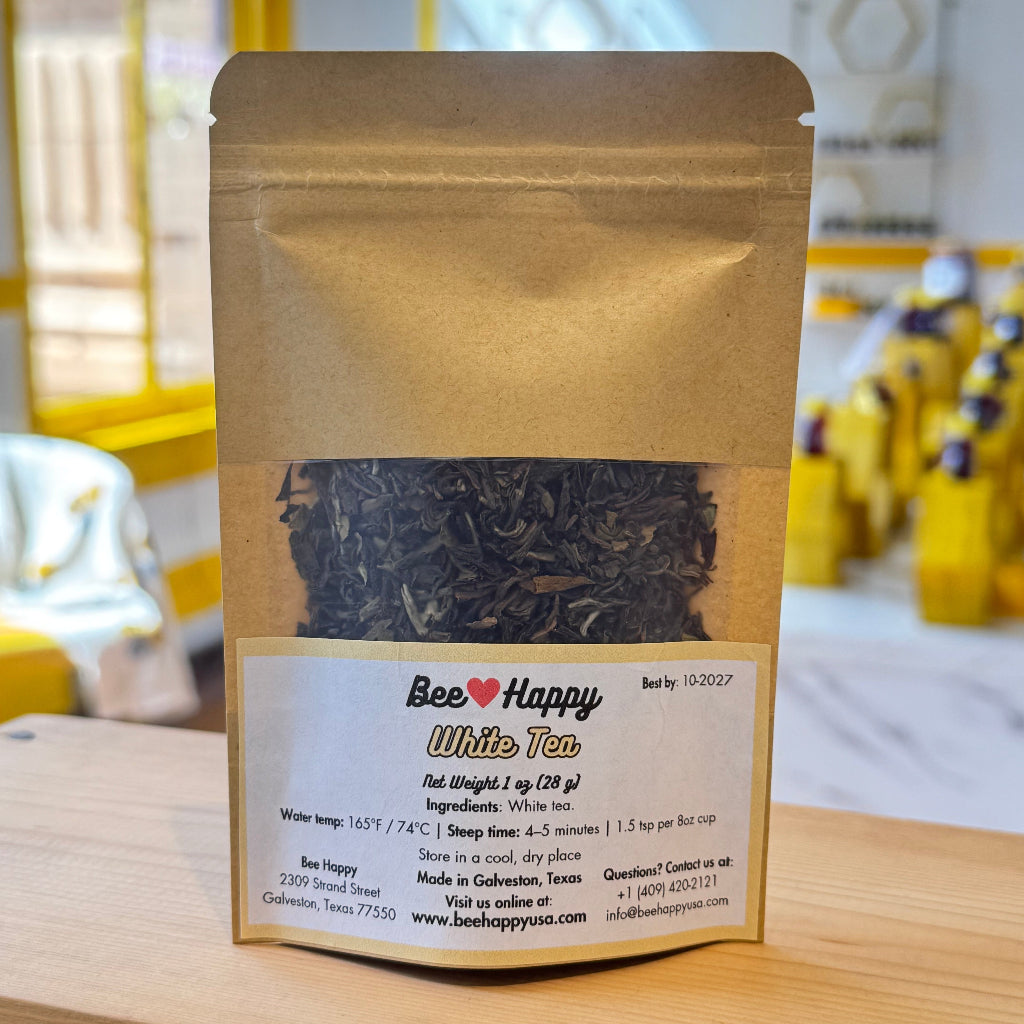 1 oz bag of white tea on a wooden surface
